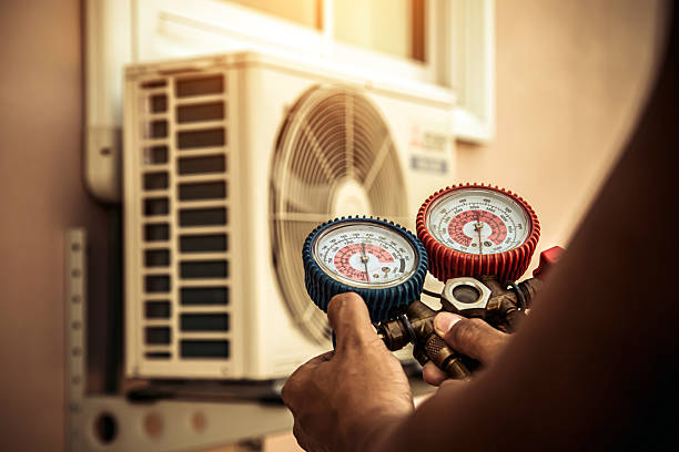 Professional Air Conditioning Service technician working in Woodside, PA